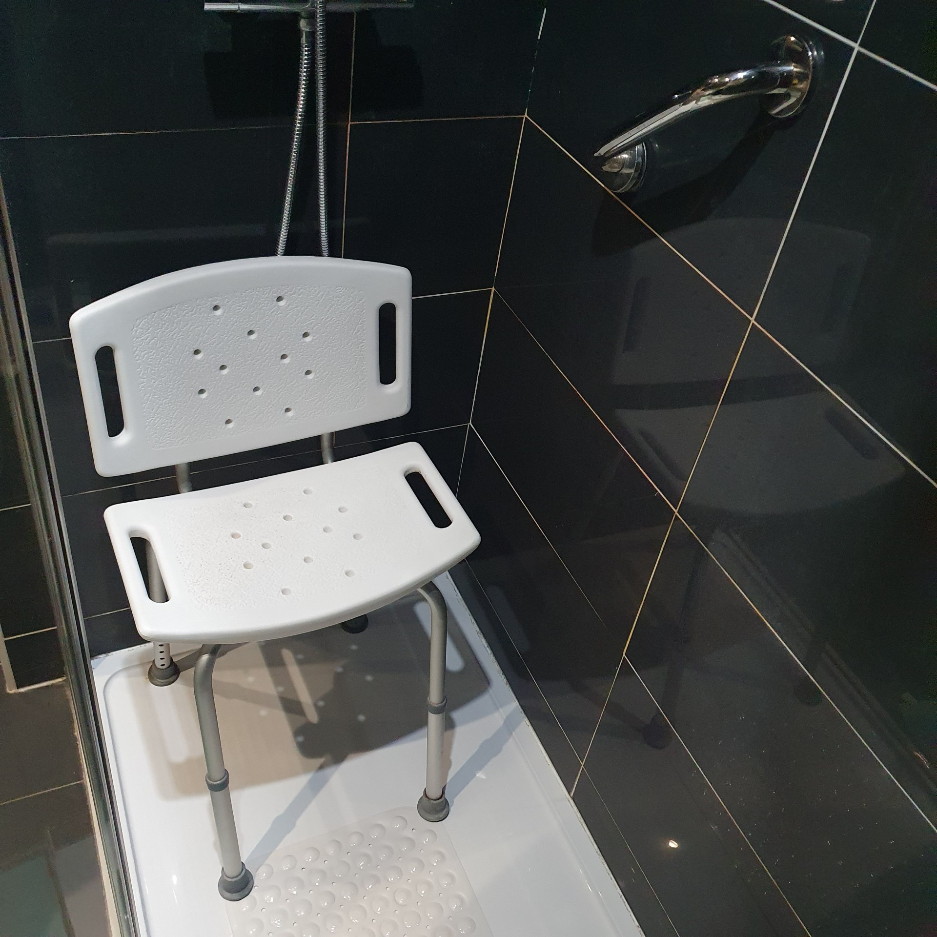Shower stool with non slip mat for safer seated washing